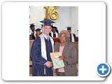 Salutatorian of the SGPAA Class of 2016, Roman Pinder receiving a gift from Evangelist Shirley Burrows -490A6560