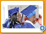 Ivanna Ferguson, surrounded by the other graduates of the WHS Class of 2016, sharing a smile during the ceremony- 490A3260