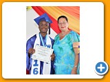 Valedictorian of the WHS Class of 2016, Naaman Rolle, receiving an award in Office Procedures from teacher Ms. Thompson - 490A3265