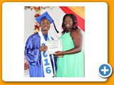 Valedictorian of the WHS Class of 2016, Naaman Rolle, receiving an award in Physical Education from teacher Ms. Campbell - 490A3283